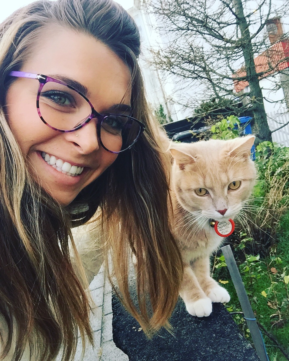 woman smiling with cat in Iceland