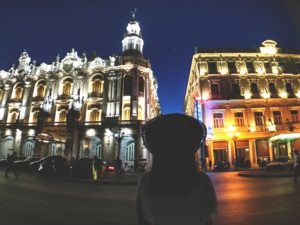 woman standing at El Prada Havana at night