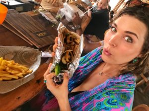 woman eating a taco at Big Mommas in aruba