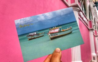 postcard of boats in aruba
