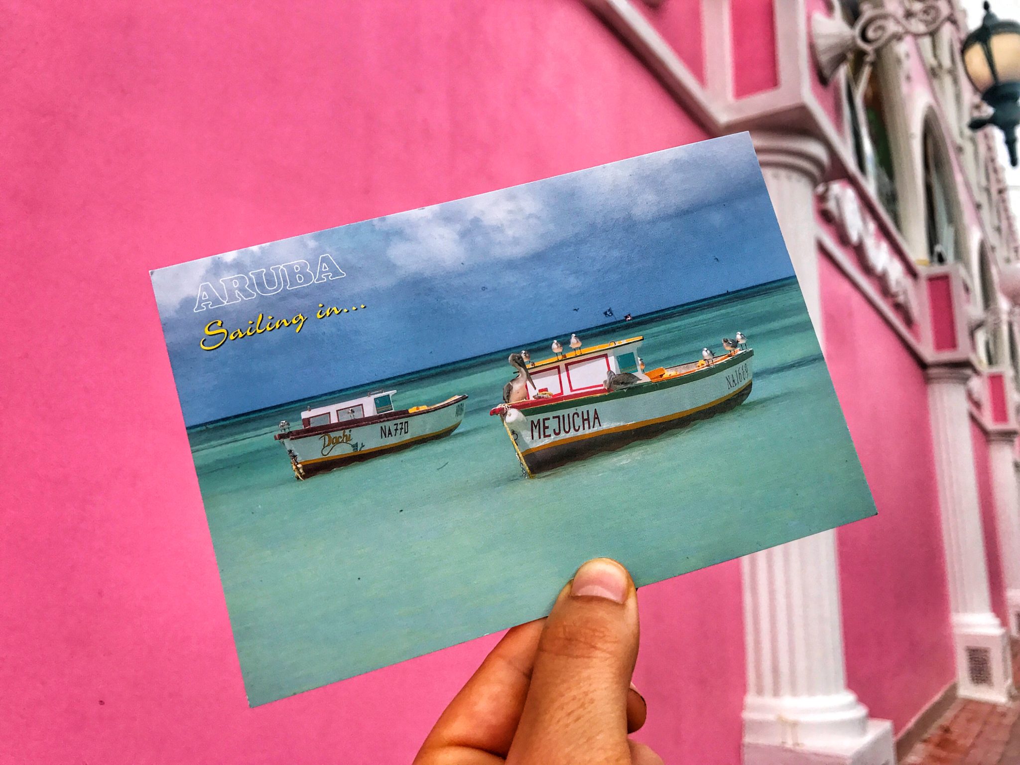 postcard of boats in aruba