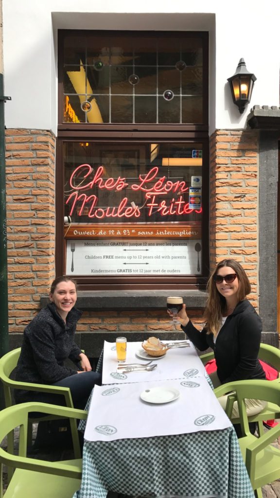 Two Women Smiling Outside of Chez Leon Restaurant in Brussels