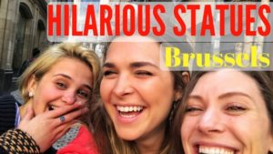 three women laughing with text that reads hilarious statues brussels