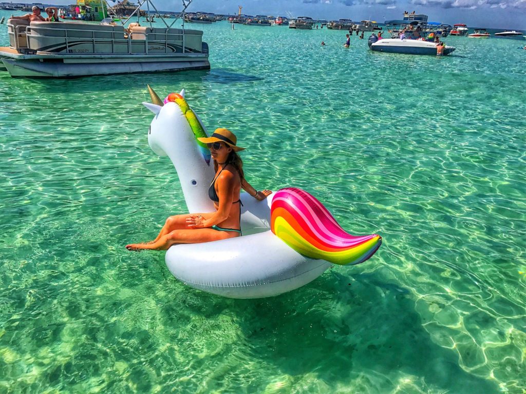 woman floating on a unicorn at crab island