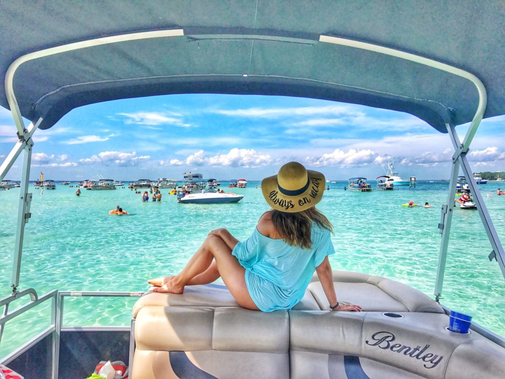 woman posing on back of boat at Crab Island Florida