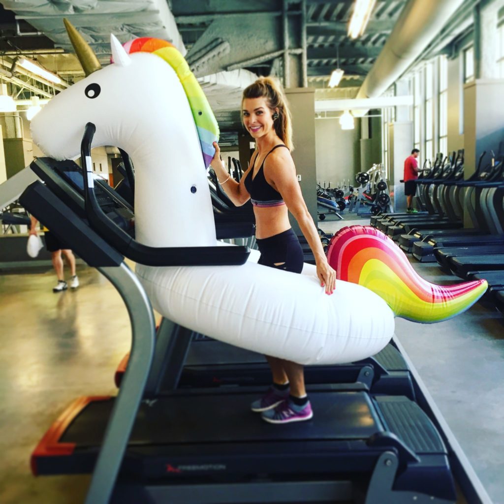 Woman with Inflatable Unicorn on a Treadmill