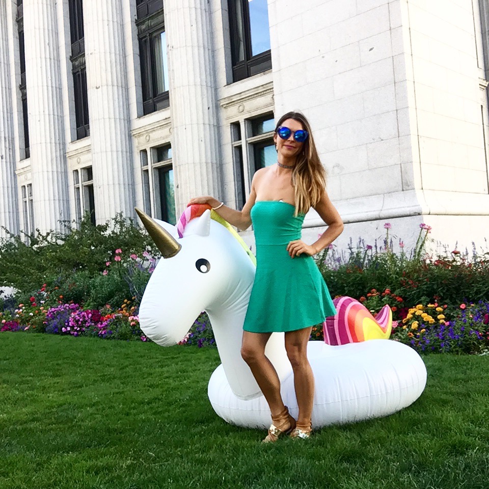 woman and inflatable unicorn at temple square in salt lake city