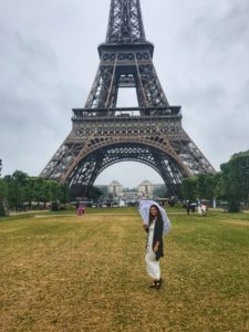 woman holding umbrella at Eiffel Tower