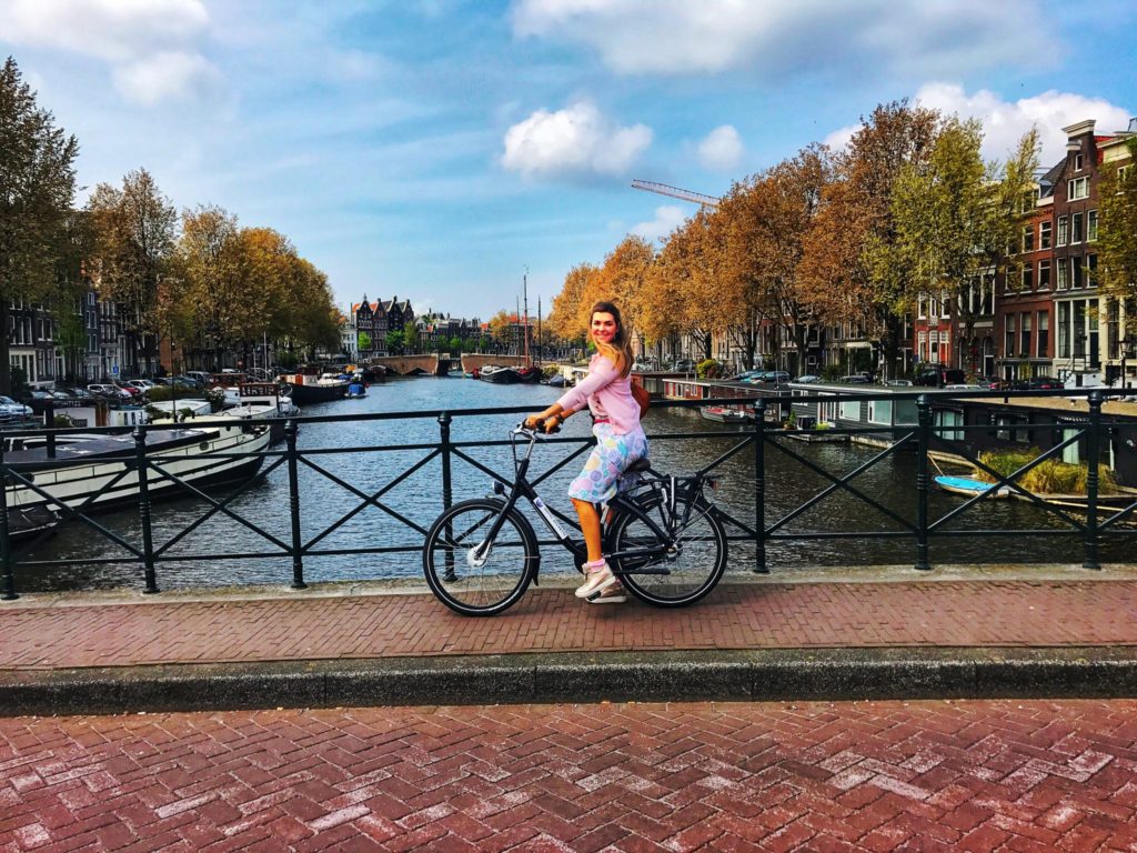 woman riding a bike in Amsterdam