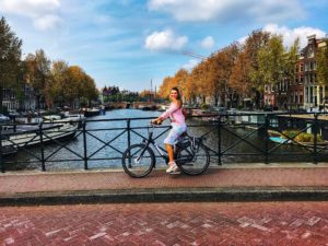 woman riding bike in Amsterdam